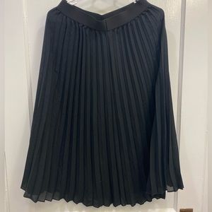 Black pleated calf-length skirt
